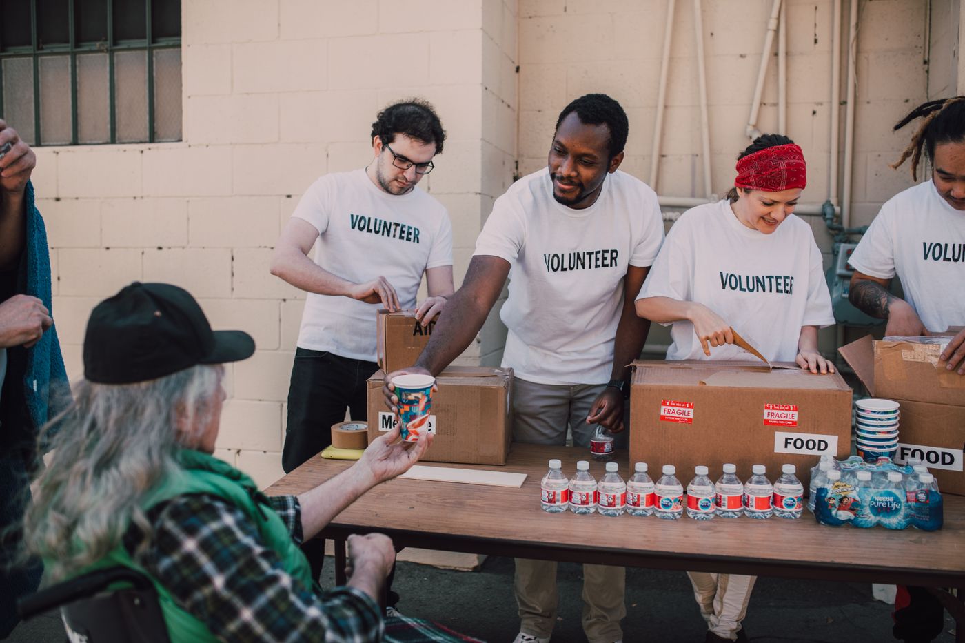 A team of volunteers working together to pack supplies for neighbors